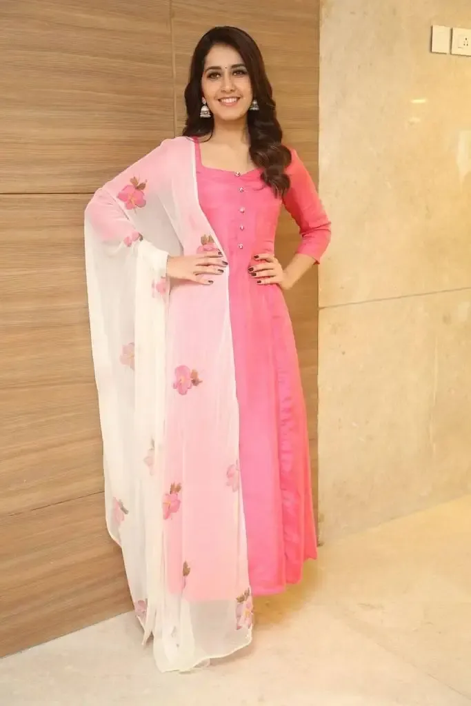 Actress Rashi Khanna Long hair smiling face In Pink Dress